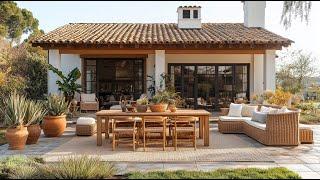 Rustic Mediterranean Outdoor Furniture Set on a Serene Patio with Greenery and Wicker Sofas