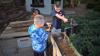 Kids Playing with Garden Water Pumps & Chutes