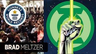 Brad Meltzer breaks Guinness Record while doing Green Lantern Oath with decoder rings