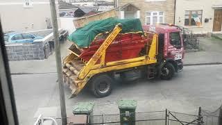 Thornton's skip driver having a bad day ... put the empty one in the garden first