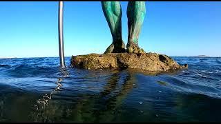 Neptuno, escultura de Luis Arenciba Betancort & Playa de Melenara, Telde, Gran Canaria.