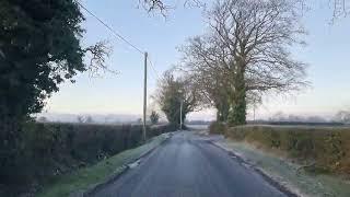 Driving through Irish village in County Kildare, Ireland 