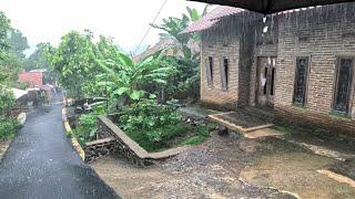 Heavy rain and thunderstorms in rural Indonesia|rainwater floods roads