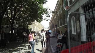 Walking in Brick Lane market on the way to Beigel Bake (24 Hour Bagel Shop) London Sunday 17/07/2011