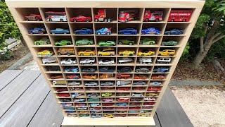 105 miniature cars and a building-style miniature car storage case