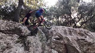 Trials rider Janine Jungfels climbs a cliff.