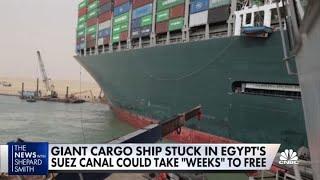 Giant cargo ship stuck in Egypt's Suez Canal could take 'weeks' to free