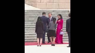 Xi and his wife walking down steps to welcome Vietnam's Lams in Beijing