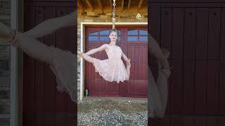 Watch in awe as she dances effortlessly while hanging by her hair!