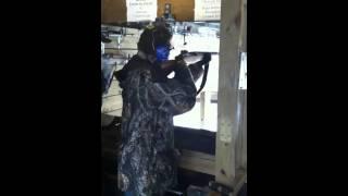 Mike shoots a rifle
