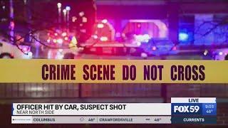 IMPD: Officer hit by car, driver shot near CVS on Indy's near north side