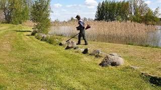 Husqvarna Brushcutter 545RXT Mowing Around Obstacles (Stones).