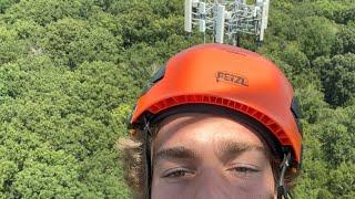 Justin Zappala is climbing a cell tower for work