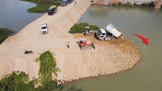 Good Action mighty Construction of clean water system by two small bulldozer push land in water