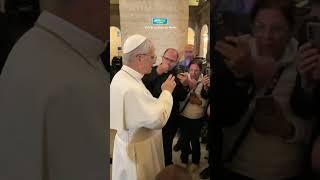 Pope Leo XIV blesses people at the Palace of the Holy Office on the same evening he was elected Pope