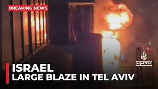 Large blaze in Tel Aviv after raid sirens sound