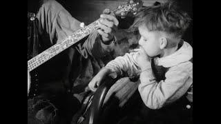 6-year old smokes and dances to banjo (Kentucky, 1940)