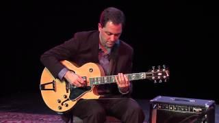 Andy Brown playing solo jazz guitar doing a Blues In G