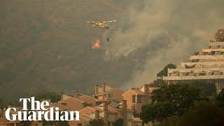 Wildfire in south of Spain forces thousands to flee their homes