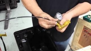 Setting gas pressure on hydraulic breaker