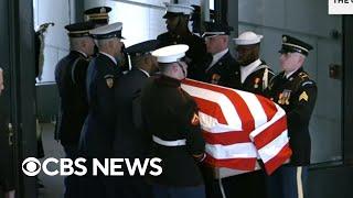 Jimmy Carter's casket arrives at the Carter Center in Atlanta