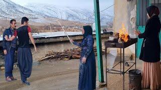 Abbas's stepmother throws her belongings outside the house in the heavy rain.