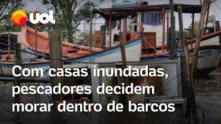 Rio Grande do Sul: Com casas inundadas, pescadores de Pelotas decidem morar dentro de barcos