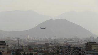 Airplanes land and take off at Kabul airport as evacuations continue | AFP