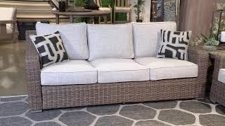 Beachcroft Beige Outdoor Sofa with Cushion from Signature Design by Ashley