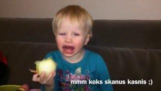 Svogunai - little girl eats an onion first time
