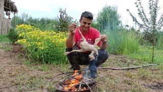 Cooking food on the fire. This is a delicious chicken. I cook and sing to my wife