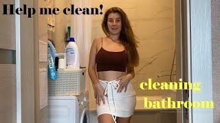 I clean bathroom in skirt and crop top