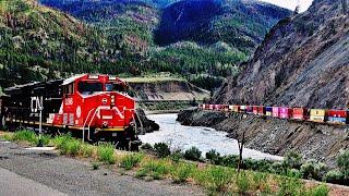 HUGE TRAINS MEET THRU TUNNELS & SHEDS IN THE THOMPSON CANYON - CANADA