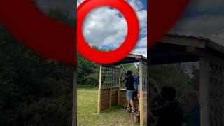 Hit corner of a clay pigeon during sporting shotgun shooting