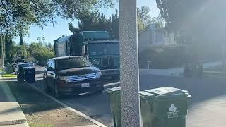 Yard waste truck collecting yard waste in the morning and afternoon