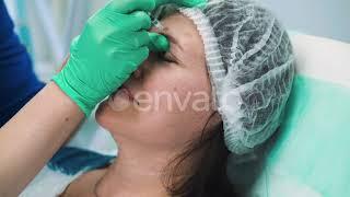 Beautician in Gloves Does Dysport Injections To Woman