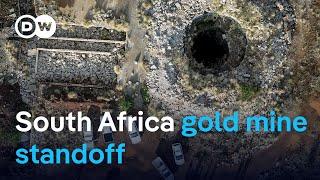 South African gold mine siege in third week | DW News