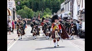 The Highlanders Pipes & Drums lead the Queen's Guard of Honour through Ballater to barracks Aug 2018