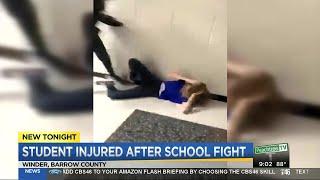 Girl hospitalized after school fight caught on video
