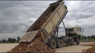 Dump Truck Unloading dirt - Dump Trucks at Work - Dump trucks in action