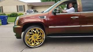 Escalade on 30 inch Gold rims and custom paint