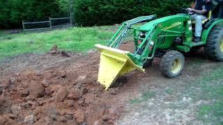 Saturday Morning work with son and grandson...John Deere 2520 and titan stump bucket.