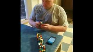 Kyle solves seven Rubik's cubes