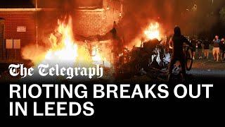 Leeds riots: Police car flipped and bus on fire as violence breaks out