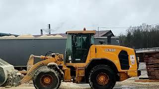 Loading a truck with an excavator. Loading