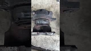 Unsticking a frozen brake caliper piston with grease gun the easy way!