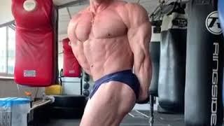 Hugeg Muscle God Deividas Dubinas (Lithuania) flexing at the gym
