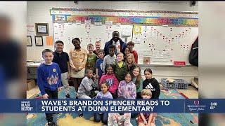 WAVE News reporter Brandon Spencer reads to students at Dunn Elementary School