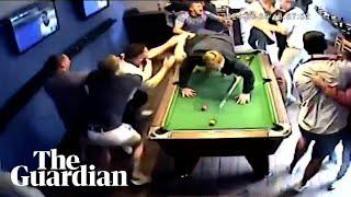 Fans dive across pool table in euphoric celebration of Jude Bellingham goal