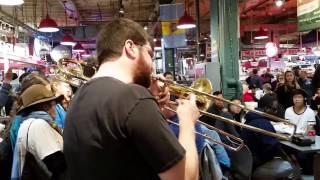 Philadelphia Jazz Project at Reading Terminal Market: Jay Fluellen directing Polished Brass